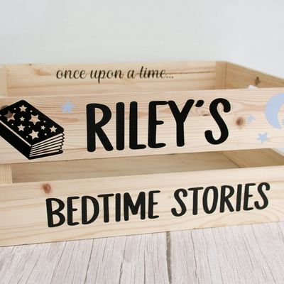 Wooden crate lettered “once upon a time… Riley’s Bedtime Stories” with a book illustration