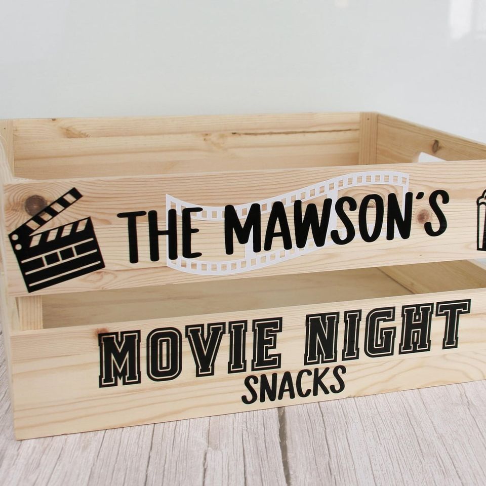 Wooden crate lettered “The Mawson’s Movie Night Snacks” with a film clapperboard