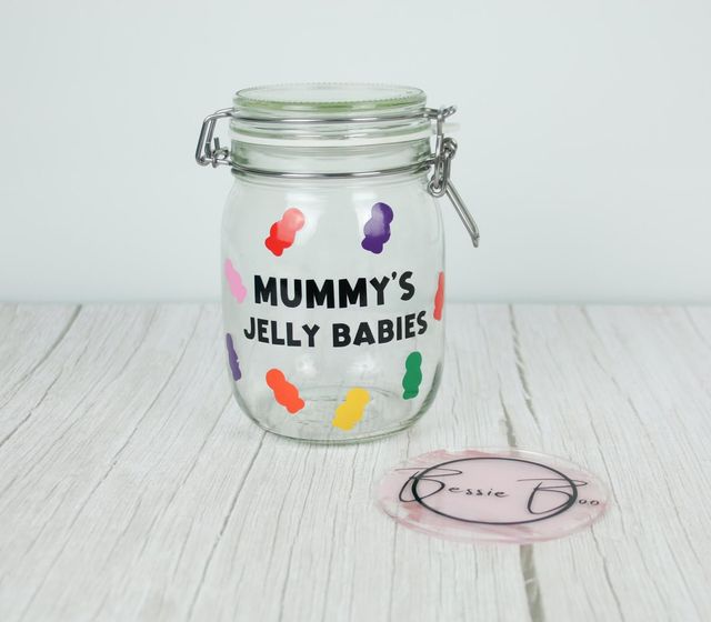 Clip-top glass jar lettered “Mummy’s Jelly Babies” with colourful jelly baby shapes