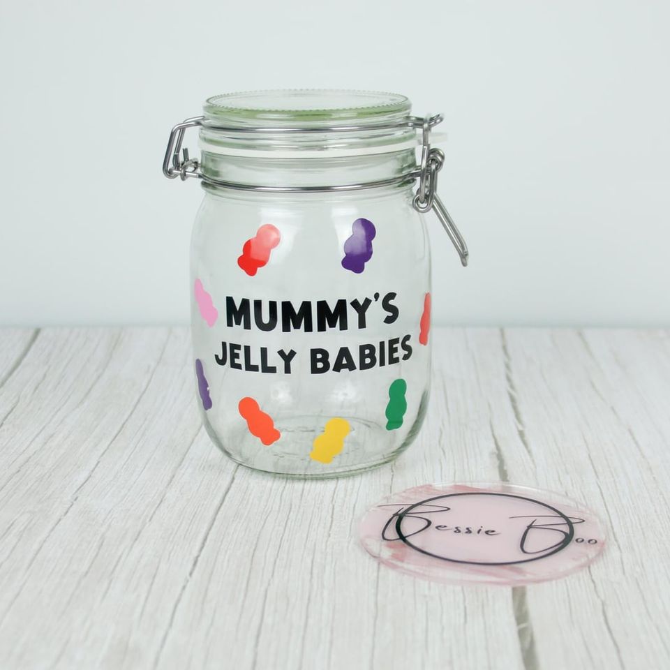 Clip-top glass jar lettered “Mummy’s Jelly Babies” with colourful jelly baby shapes