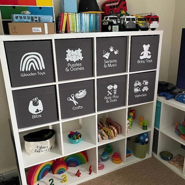Grey cube storage boxes with white picture labels for wooden toys, puzzles, crafts and vehicles