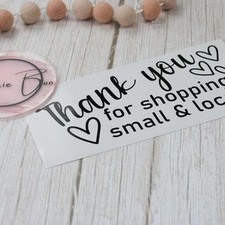 Black vinyl decal reading “Thank you for shopping small & local” with hearts