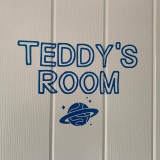 Door lettered “Teddy’s Room” in blue outline letters with a planet